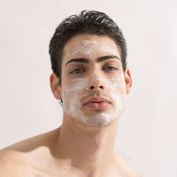 young man with smooth skin and About time we met's cream cleanser on