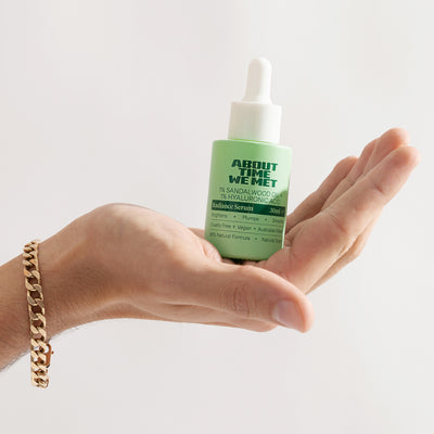 hand holding About time we met's radiance serum part of the time to glow bundle