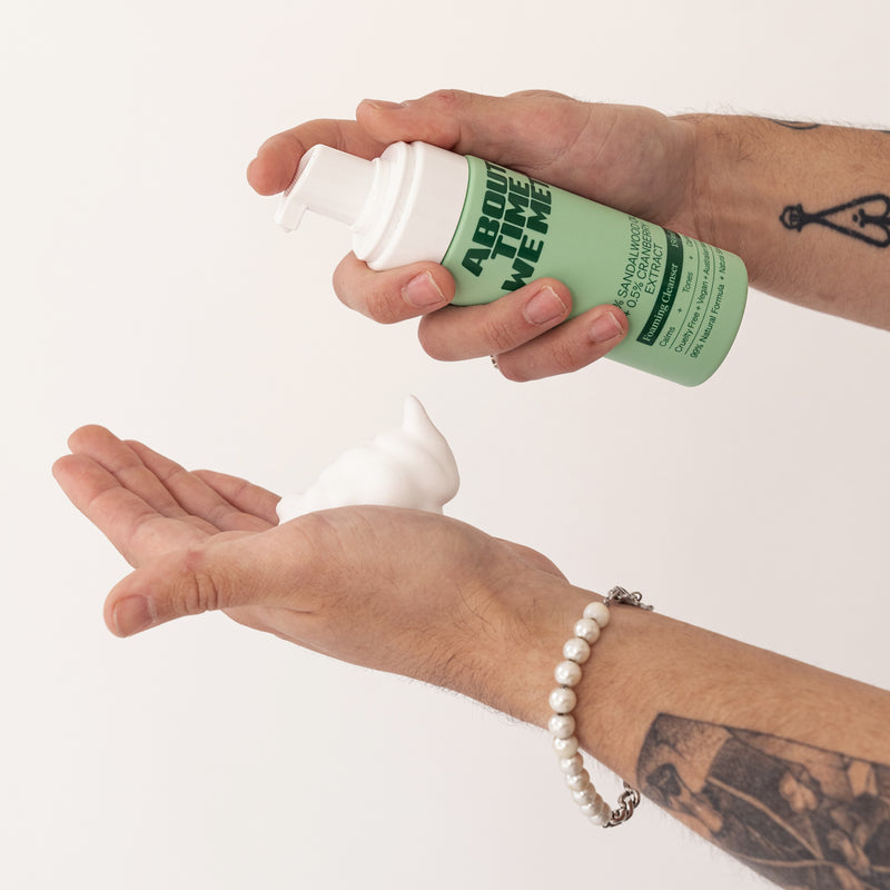 person applying About time we met's foaming cleanser on hands