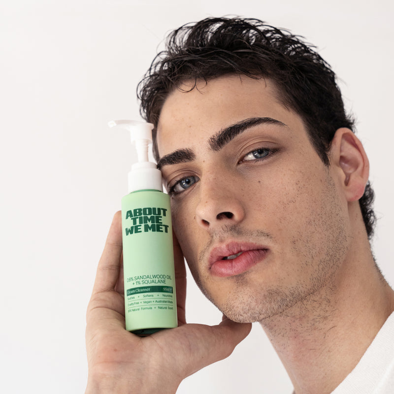 young man holding About time we met's cream cleanser